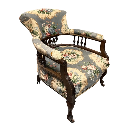 578 - A Victorian upholstered tub armchair with mahogany frame on dwarf cabriole front legs.