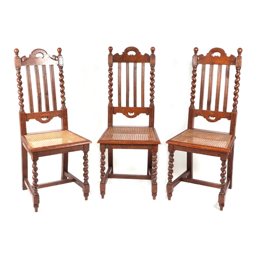 746 - A set of three Elizabethan style oak dining chairs with barleytwist back supports and cane seats (3)... 