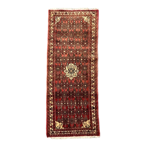 35 - A Persian Turkoman hand knotted rug, the central medallion within a multi border, 130 by 198cms, tog... 