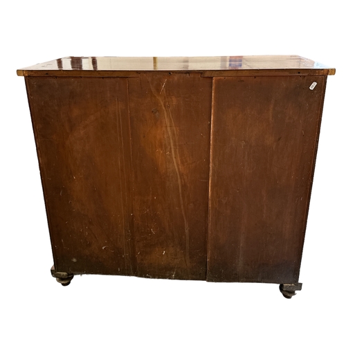 734 - A Victorian mahogany chiffonier with single frieze drawer above two field panelled doors enclosing a... 