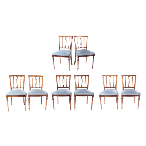 751 - A set of eight reproduction mahogany dining chairs with upholstered seats.