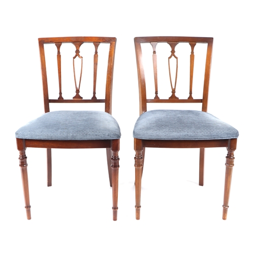 751 - A set of eight reproduction mahogany dining chairs with upholstered seats.