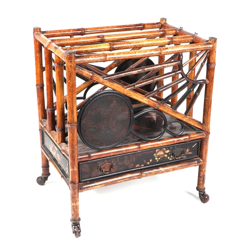 756 - An Aesthetic period bamboo and black lacquer three-division Canterbury with single frieze drawer, th... 