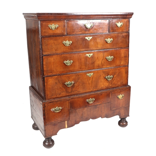 744 - A 19th century walnut chest-on-stand, the chest with an arrangement of six drawers, on stand with th... 