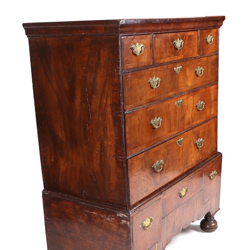 744 - A 19th century walnut chest-on-stand, the chest with an arrangement of six drawers, on stand with th... 