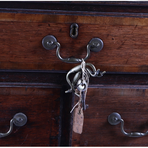 590 - A George III and later oak mule type chest, the rectangular lift-up lid above an arrangement of five... 