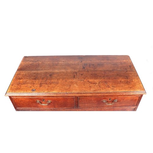 743 - A George III oak chest of two short and three graduated long drawers, on ogee bracket feet, 101cms w... 