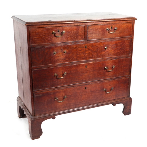 743 - A George III oak chest of two short and three graduated long drawers, on ogee bracket feet, 101cms w... 