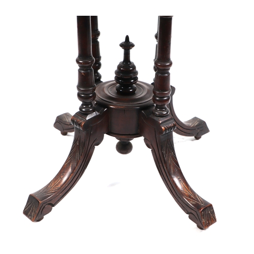 738 - A late Victorian walnut occasional table, the octagonal top inlaid with garlands of leaves, quatrefo... 