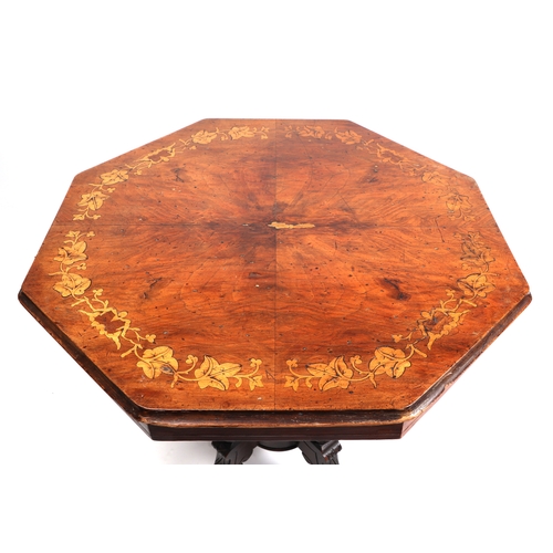 738 - A late Victorian walnut occasional table, the octagonal top inlaid with garlands of leaves, quatrefo... 