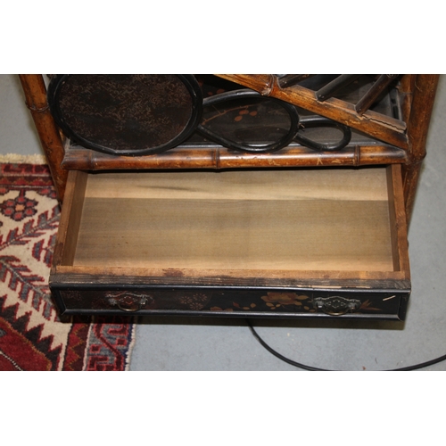 756 - An Aesthetic period bamboo and black lacquer three-division Canterbury with single frieze drawer, th... 