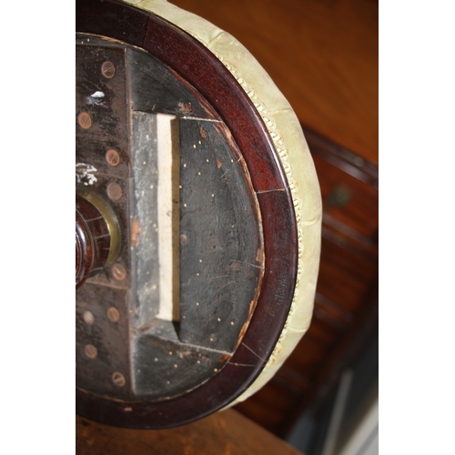 705 - A Victorian carved walnut adjustable piano stool on a tripod base with carved acanthus leaf decorati... 