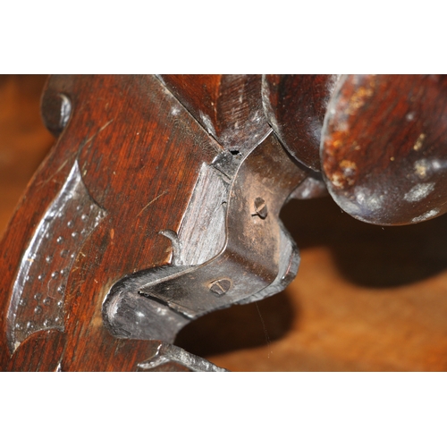 705 - A Victorian carved walnut adjustable piano stool on a tripod base with carved acanthus leaf decorati... 