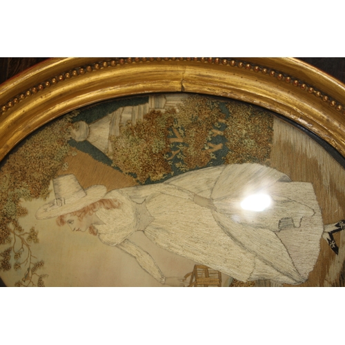 33 - A 19th century silk needlework oval panel depicting a young lady with white dress and bonnet holding... 