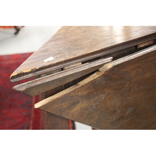 718 - A George II oak triangular drop-leaf occasional table of joint pegged construction with tapering leg... 