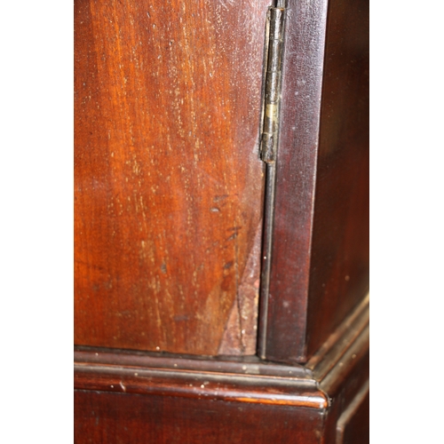 727 - A George III mahogany bowfront linen press with dentil cornice above a pair of panelled doors enclos... 