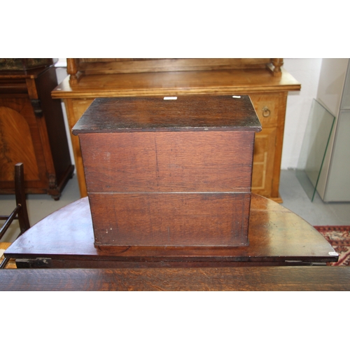 573 - A late 19th / early 20th century oak table top cupboard, the pair of doors enclosing pigeon holes, 4... 