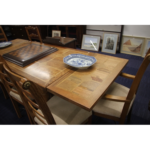 722 - A modern fruitwood extending dining table on turned legs joined by an 'H' stretcher; together with s... 