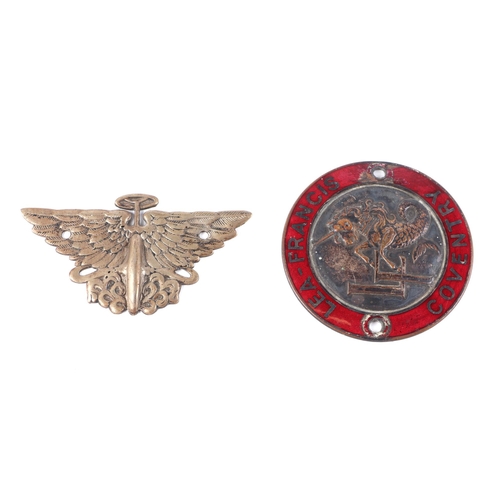 14 - A vintage Austin Wings & Wheel car badge; together with a French enamel car badge (2).