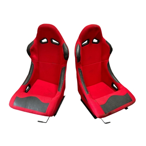 15 - A pair of bucket racing seats with holes for 3-point seatbelt attachment and adjustable sliding rail... 