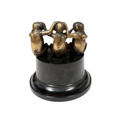 31 - A Three Wise Monkeys brass accessory car mascot mounted on a plinth, approx 8cms wide.