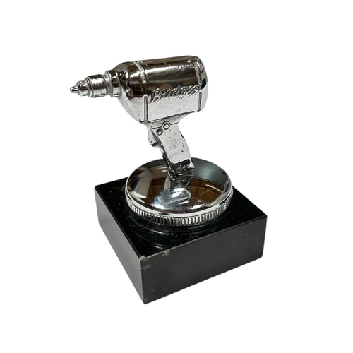 36 - A British Electric Co chrome plated accessory car mascot in the form of a drill, mounted on a plinth... 