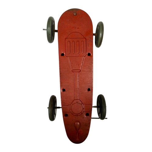 58 - A Mettoy tin plate clockwork single seat racing car with lithograph printed decoration, 30cms long.