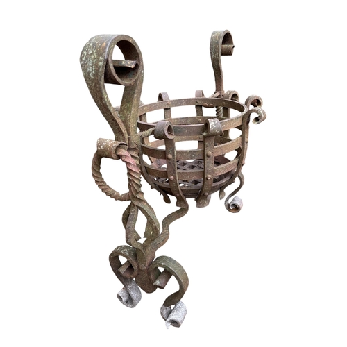 106 - A medieval style wrought iron fire basket, 70cms wide.