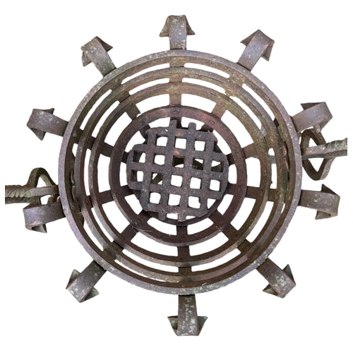 106 - A medieval style wrought iron fire basket, 70cms wide.