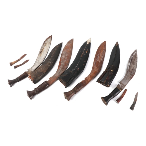 113 - A group of four Nepalese Kukri in original scabbards (4).