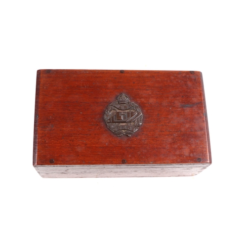 119 - A hardwood box with Tank Corp emblem to the top containing various cap badges and cloth badges to in... 