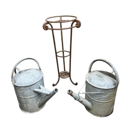 12 - A quantity of terracotta plant pots;  galvanised watering cans; a butler's sink and a wrought iron s... 