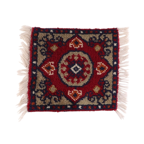 127 - A group of three hand knotted sample rugs, each 37 by 39cms (3).