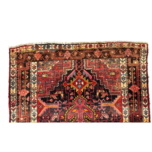 151 - A Persian Nahavand hand knotted rug, the central medallion framed by stylised floral designs and fou... 