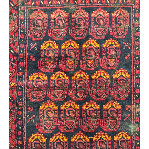 155 - A Persian Hamadan hand knotted woollen rug with repeating boteh design within floral borders, on a n... 