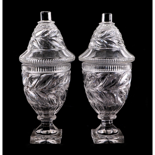 247 - A pair of cut glass bonbon dishes and covers, 31cms high (2).