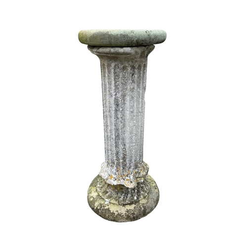 5 - A well weathered stone column with associated base and top, 102cms high.