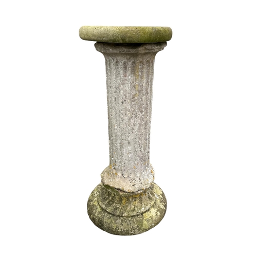 5 - A well weathered stone column with associated base and top, 102cms high.