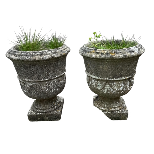 7 - A pair of well weathered garden planters, each 39cms high (2).