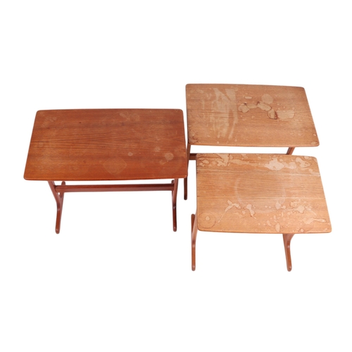 818 - A nest of three Mid century modern teak occasional tables, the largest 55cms wide; together with ano... 