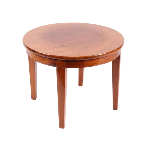 822 - An Art Deco style American walnut circular occasional table on tapering square legs, 60cms diameter.