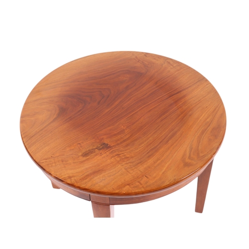 822 - An Art Deco style American walnut circular occasional table on tapering square legs, 60cms diameter.