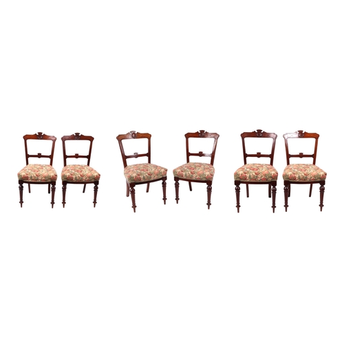 824 - A set of six late Victorian / Edwardian walnut dining chairs with carved back rails, over-stuffed se... 