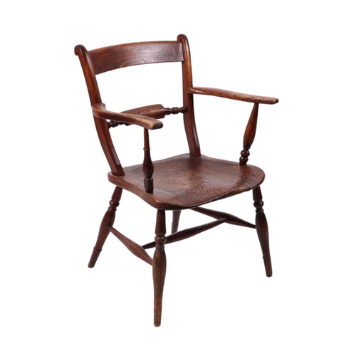 826 - A 19th century oak and elm kitchen armchair with turned back rail, solid seat, turned front legs joi... 