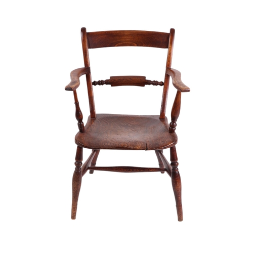 826 - A 19th century oak and elm kitchen armchair with turned back rail, solid seat, turned front legs joi... 