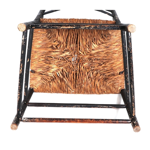 832 - An Arts and Crafts Pass chair in the style of Ernest Gimson (1864-1919), made in ebonised ash with r... 