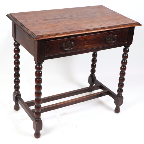 833 - An 18th century style oak side table with single frieze drawer on bobbin turned legs joined by a str... 