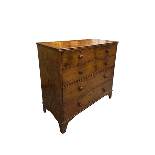 834 - A 19th century oak chest with two short and three graduated long drawers standing on bracket feet. 1... 