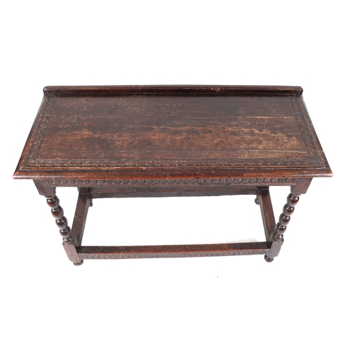 830 - A 17th century Jacobean oak side table, the rectangular top with shallow gallery and carved decorati... 