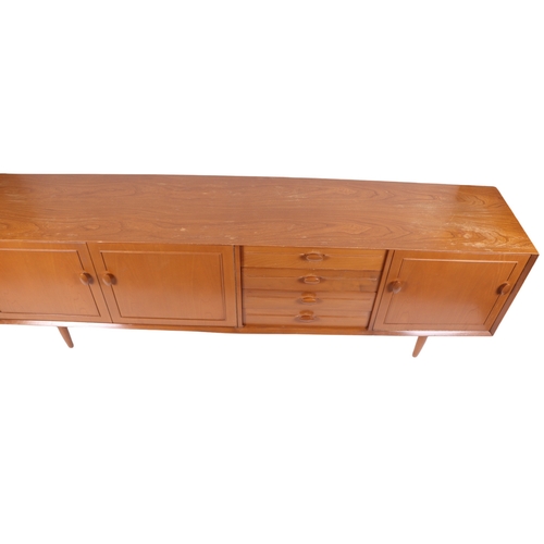 819 - A mid century modern 1960's teak sideboard with an arrangement of four central drawers flanked by a ... 